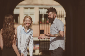 Its so funny. Friendship begins with smile. Bearded man and pretty women smiling on street. Boyfriend dating girlfriends. People enjoying each others company. Bonds of friendship. Happy friends