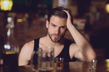 Dependence or addiction. Alcoholic man drinking at bar counter. Drinking alcohol. Man drink strong alcoholic beverage and beer in pub. Alcohol addict with short alcohol drink. Alcohol addiction