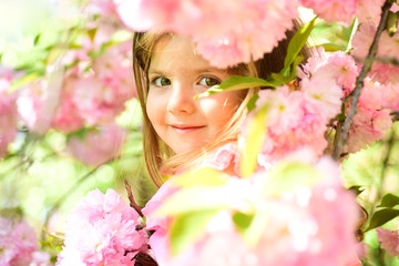 Fototapeta premium Small child. Natural beauty. Childrens day. Springtime. weather forecast. Summer girl fashion. Happy childhood. Little girl in sunny spring. face skincare. allergy to flowers. Enjoying spring holiday