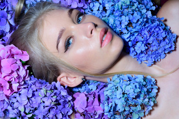 Spring woman with hydrangea flowers. girl with summer makeup. Summer beauty. Fashion portrait of woman. Healthy hair and skin. Makeup cosmetics and skincare. i am a spring