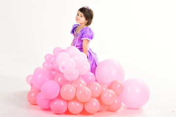 Obraz na płótnie Canvas Happy birthday. Childrens day. Small pretty child. Childhood and happiness. Little girl in princess dress. Kid fashion. Little miss in beautiful dress. Party balloons. Lost in her fairytale