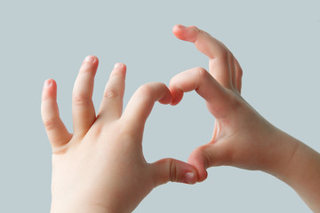 Heart shape from the fingers of a child