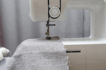Naklejka premium Close up of sewing machine working with fabric. Sewing Process 