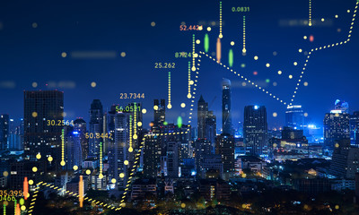 Beautiful Bangkok skyline at night with financial chart state blend in effect .