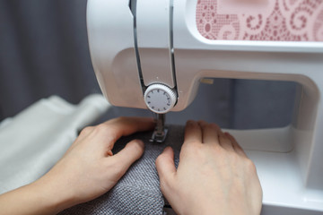 Woman working with the machine for sewing.  Sewing Process 