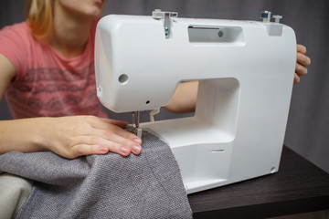 Woman working with the machine for sewing.  Sewing Process 