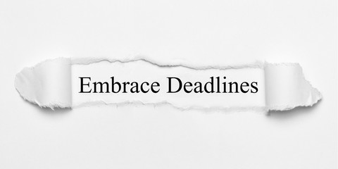 Embrace Deadlines on white torn paper