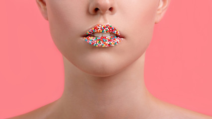 Close up view of female lips with sweet donut makeup. Fashion make up, dessert or junk food...
