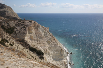 Fototapeta na wymiar Cyprus - Mediterranean Sea beach. Petra tou Romiou - Aphrodite's Rock.