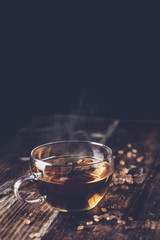 freshly poured tea with brown tea sugar