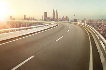 Highway overpass motion blur with city background .