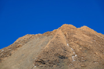 Teide iconic mountain crater with blue sky background