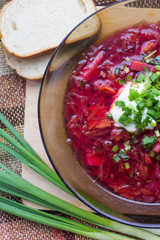 Borsch with sour cream and greens. Dinner. Red soup. Proper healthy eating.