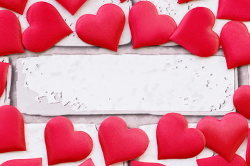 Postcard on a wooden background, decorated with hearts. Decorative card for the holiday. Vanentine...