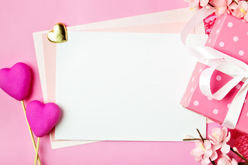 Greeting card on pink background. Selective focus. Valentines day, Womens day, Mothers day. Background with copy space. Horizontal.