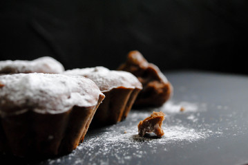 Chocolate cupcakes on a black background