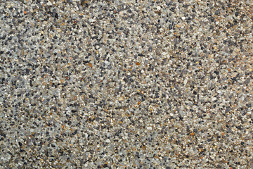 Small stones in concrete floor