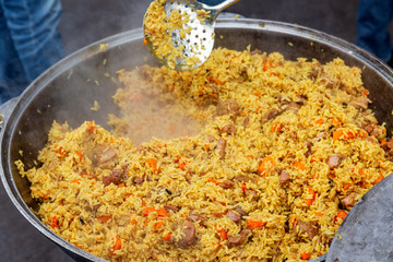 Freshly cooked pilaf in a large cauldron
