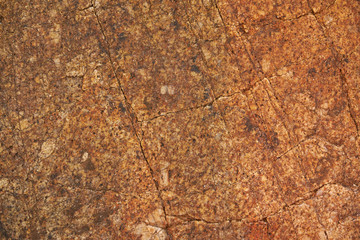 Old brown granite stone texture