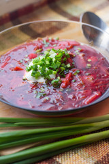 Borsch with sour cream and greens. Dinner. Red soup. Proper healthy eating.