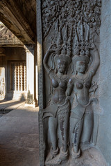Angkor Wat ancient temple complex, stone sculpture detail, one of the largest religious monuments in the world and UNESCO World Heritage Site, it's a famous tourist attraction in Siem Reap, Cambodia.