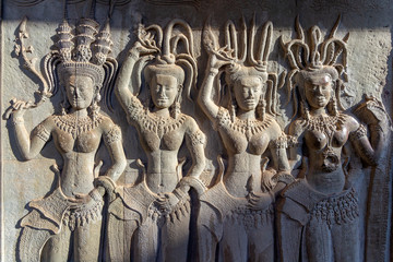 Angkor Wat ancient temple complex, stone sculpture detail, one of the largest religious monuments in the world and UNESCO World Heritage Site, it's a famous tourist attraction in Siem Reap, Cambodia.