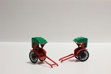 red vintage oriental rickshaw cab