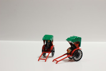 red vintage oriental rickshaw cab