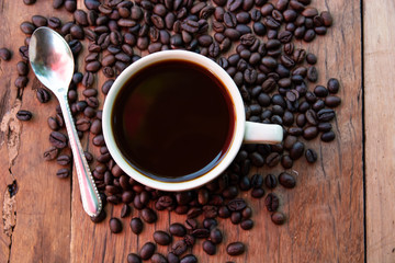 Roasted coffee beans on wooden table