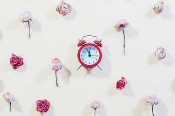 Floral pattern decor with clock. Time to celebrate concept. Rose flowers on ivory background.