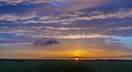 Sunrise on a beautiful morning with clouds and colorful sky