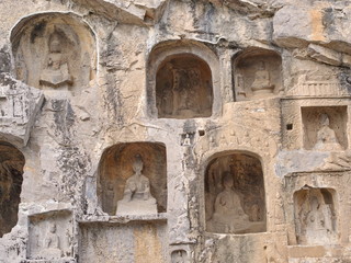 Luoyang Longmen grottoes. Broken Buddha and the stone caves and sculptures in the Longmen Grottoes in Luoyang, China. Taken in 14th October 2018