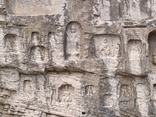 Luoyang Longmen grottoes. Broken Buddha and the stone caves and sculptures in the Longmen Grottoes in Luoyang, China. Taken in 14th October 2018