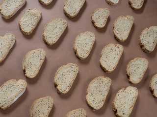 Bread with seeds pattern on brown background