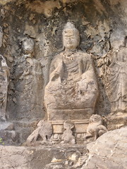 Fototapeta na wymiar Luoyang Longmen grottoes. Broken Buddha and the stone caves and sculptures in the Longmen Grottoes in Luoyang, China. Taken in 14th October 2018