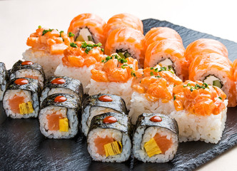 Sushi set on ceramic boards. On white background