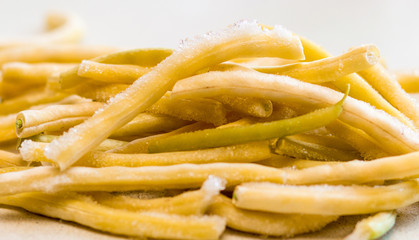 Frozen vegetables:  french beans. Frozen cut  beans vegetable. The concept of vegetarianism, background.