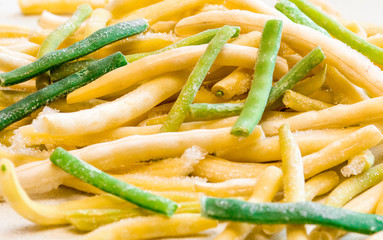 Frozen vegetables:  french beans. Frozen cut  beans vegetable. The concept of vegetarianism, background.