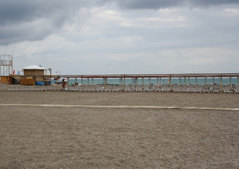 beach is equipped with chaise-longues and lifeguard post