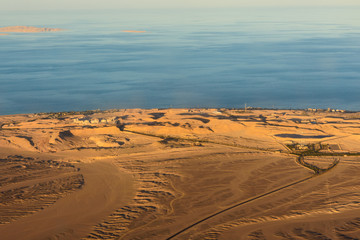 Aerial view on arabian desert and Red sea from the airplane