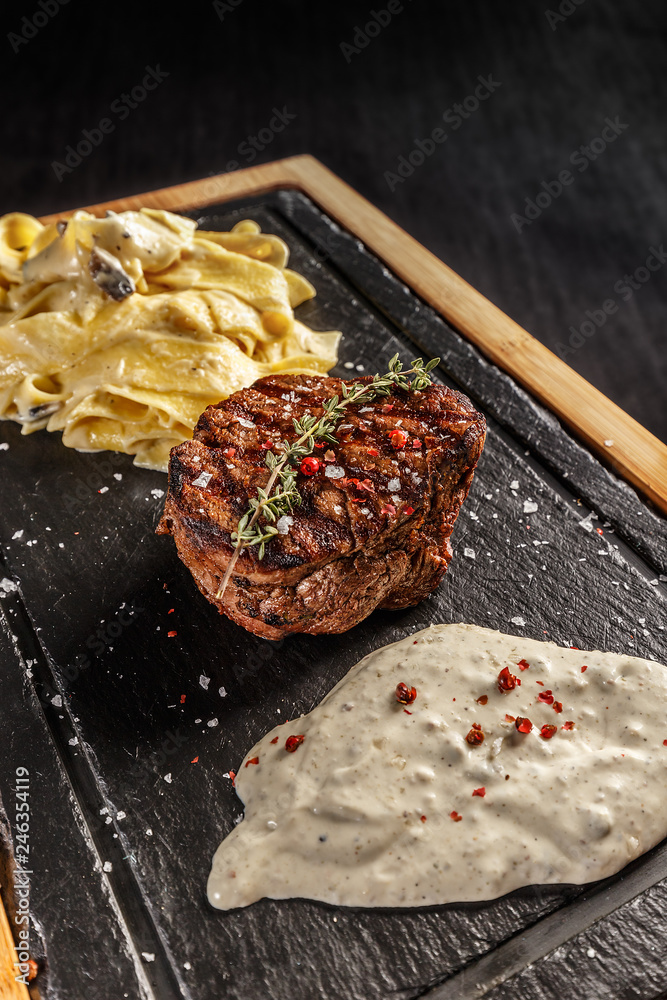 Wall mural tenderloin steak with pasta pappardelle