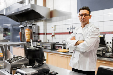 Fototapeta premium people, fast food and cooking concept - chef at kebab shop