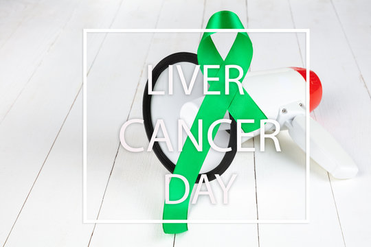 Liver Cancer and Hepatitis B - HVB Awareness month ribbon, Emerald Green or Jade ribbon awareness color on wooden background. The cancer, health, help, care, support, hope, illness, survivor