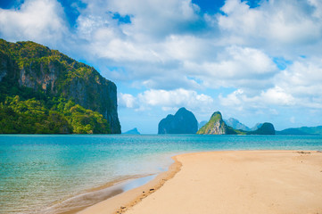 Paradise island between the rocks in the ocean