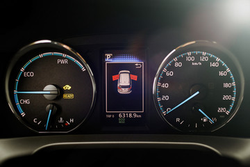 Hybrid car dashboard speedometer .