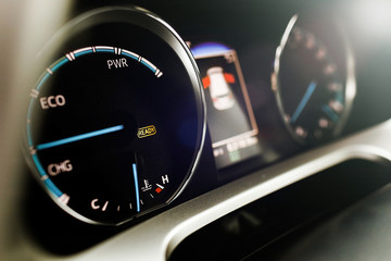 Naklejka premium Hybrid car dashboard speedometer .