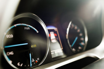 Naklejka premium Hybrid car dashboard speedometer .
