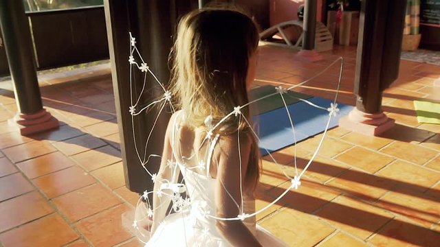 Little beautiful long-haired girl in a fairy