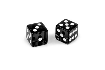 Two black glass dice isolated on white background. Three and five.