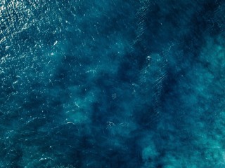 Fototapeta na wymiar Aerial view of blue sea surface